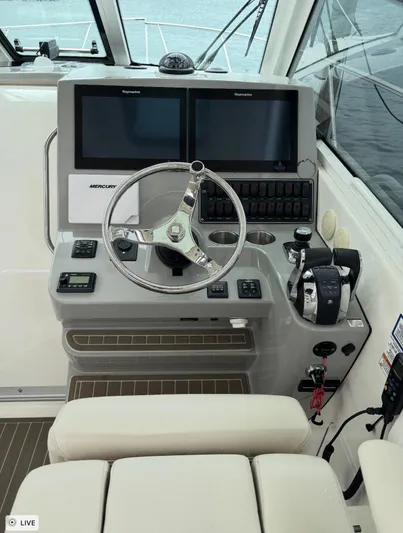  Yacht Photos Pics Helm of 2016 Boston Whaler 345 Conquest with dual Raymarine displays and Mercury controls.