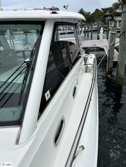  Yacht Photos Pics 2016 Boston Whaler 345 Conquest docked at marina, side view.
