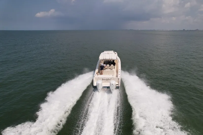  Yacht Photos Pics Grady-White Canyon 336 boat cruising on open water, 2019 model.