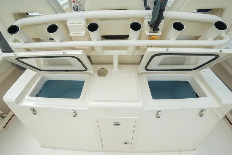  Yacht Photos Pics 2019 Grady-White Canyon 336 fishing station with open storage compartments and rod holders.