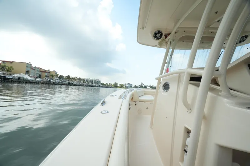  Yacht Photos Pics 2019 Grady-White Canyon 336 boat on calm water, side view.