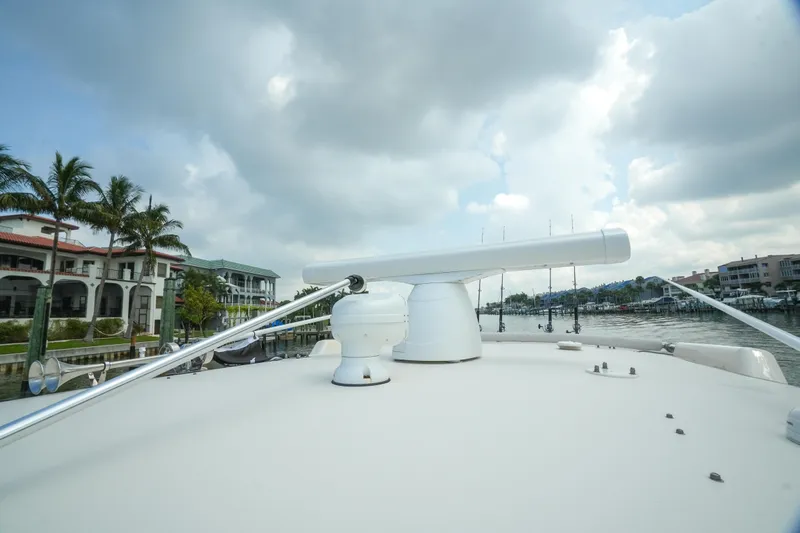  Yacht Photos Pics 2019 Grady-White Canyon 336 boat with radar, docked near waterfront homes.