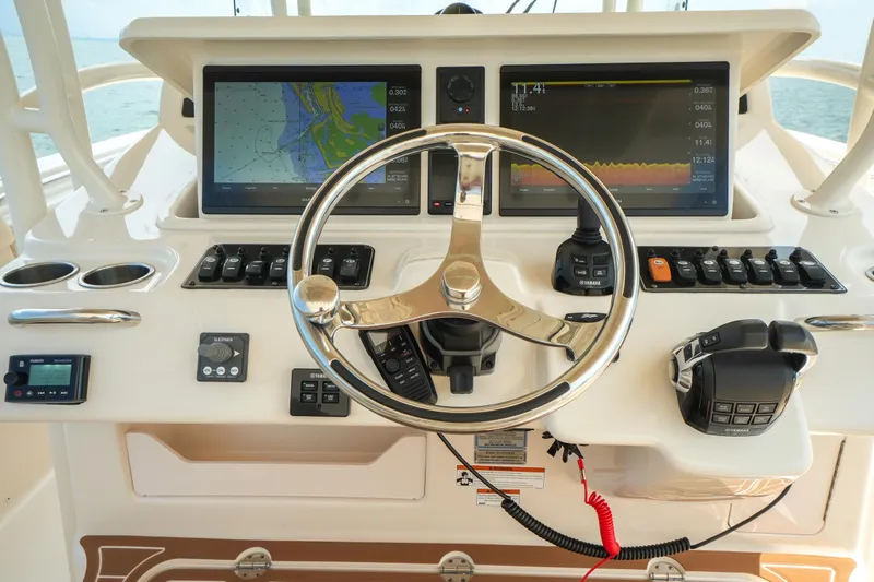  Yacht Photos Pics 2019 Grady-White Canyon 336 helm with dual navigation screens and steering wheel.