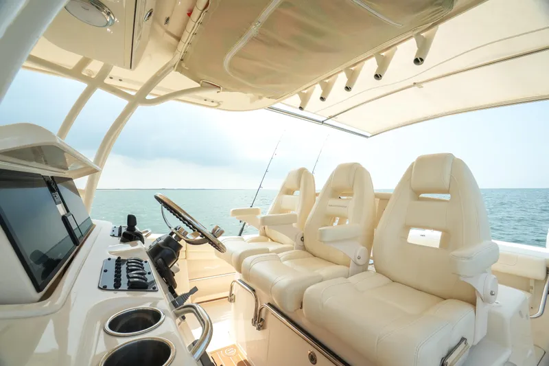  Yacht Photos Pics 2019 Grady-White Canyon 336 boat interior with luxurious seating and ocean view.