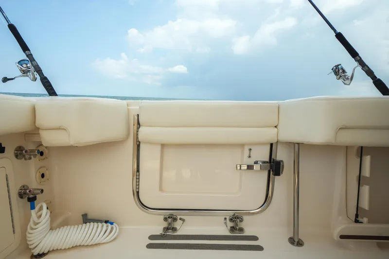  Yacht Photos Pics 2019 Grady-White Canyon 336 boat interior with fishing rods and equipment.