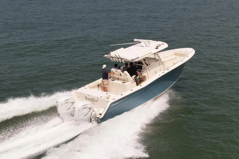 Yacht Photos Pics 2019 Grady-White Canyon 336 boat cruising on open water.