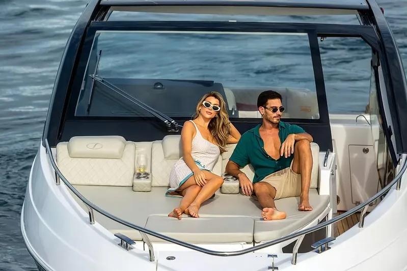  Yacht Photos Pics Manufacturer Provided Image: Couple relaxing on a 2025 Schaefer 380 yacht, enjoying a sunny day at sea.