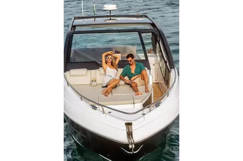  Yacht Photos Pics Manufacturer Provided Image: Couple relaxing on 2025 Schaefer 380 yacht in open water.