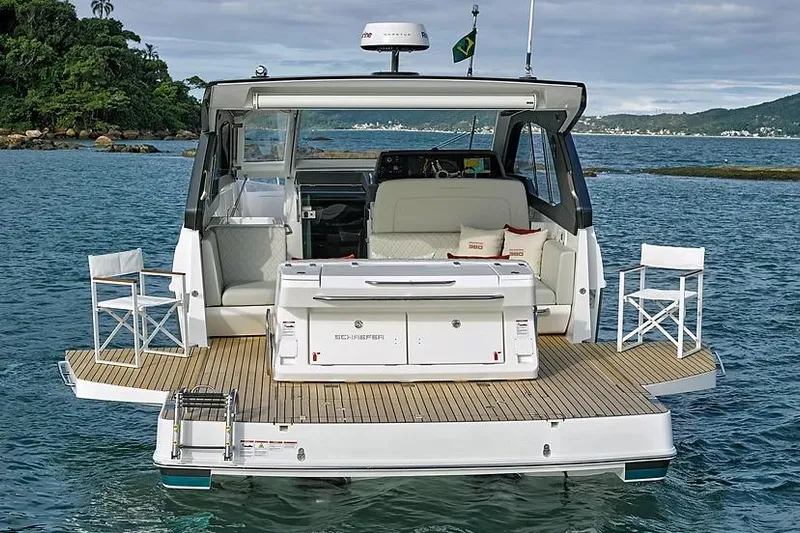  Yacht Photos Pics Manufacturer Provided Image: Schaefer 380 yacht, 2025 model, with spacious deck and seating, anchored in scenic waters.