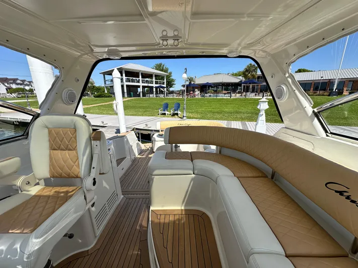 Hula Girl Yacht Photos Pics Luxurious interior of 2007 Chris-Craft Roamer 40 yacht with elegant seating and scenic marina view.