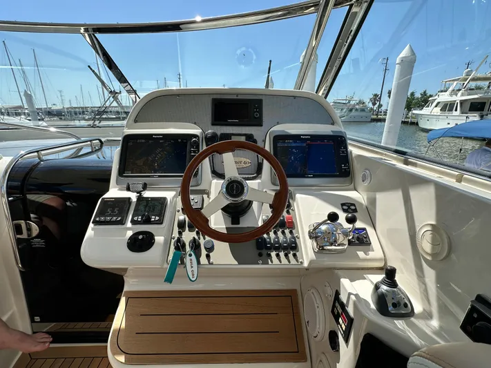 Hula Girl Yacht Photos Pics Helm of 2007 Chris-Craft Roamer 40 yacht with steering wheel and navigation controls.