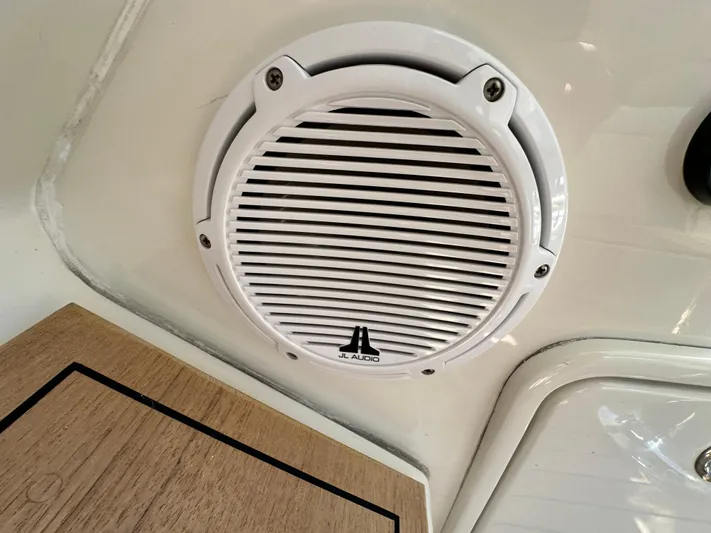 Hula Girl Yacht Photos Pics White JL Audio speaker on 2007 Chris-Craft Roamer 40 boat interior.