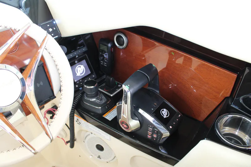 America Yacht Photos Pics 2023 Chris-Craft Launch 31 GT dashboard with steering wheel and control panel.