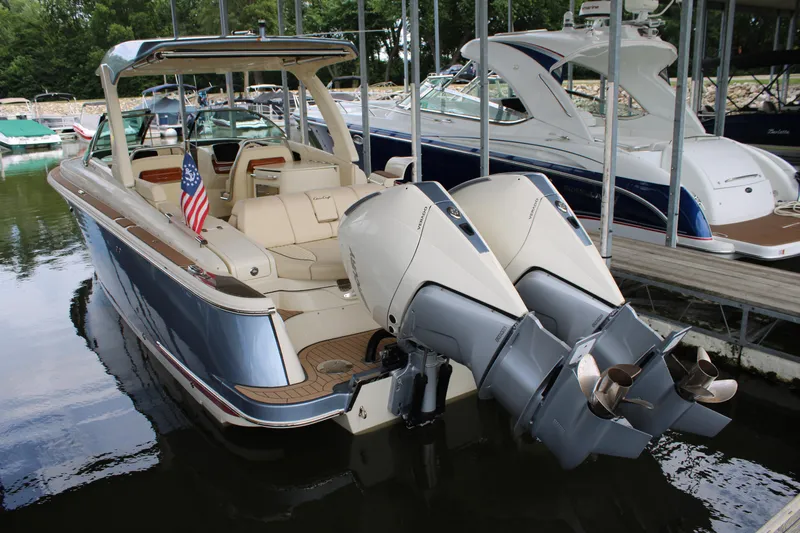 America Yacht Photos Pics 2023 Chris-Craft Launch 31 GT boat with dual outboard engines docked at marina.