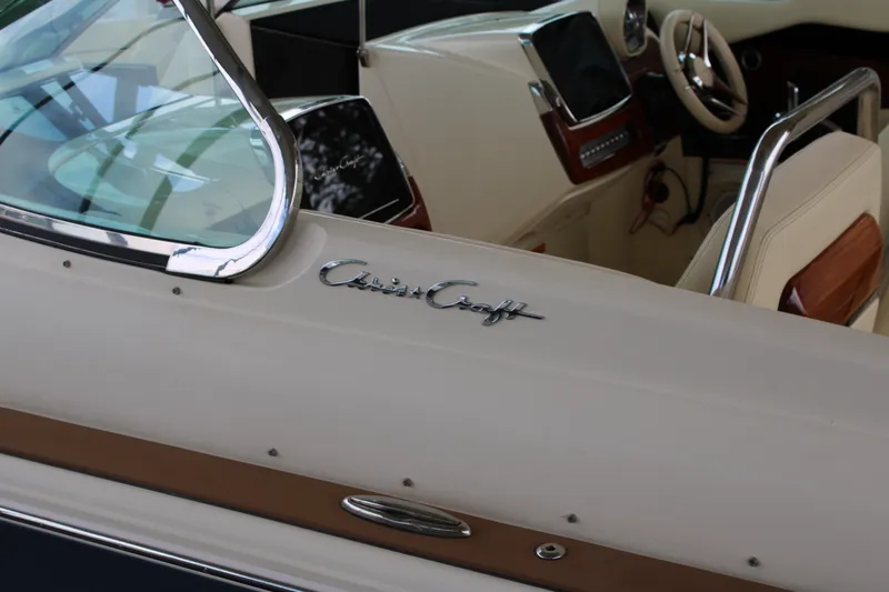 America Yacht Photos Pics 2023 Chris-Craft Launch 31 GT interior with logo and steering wheel detail.