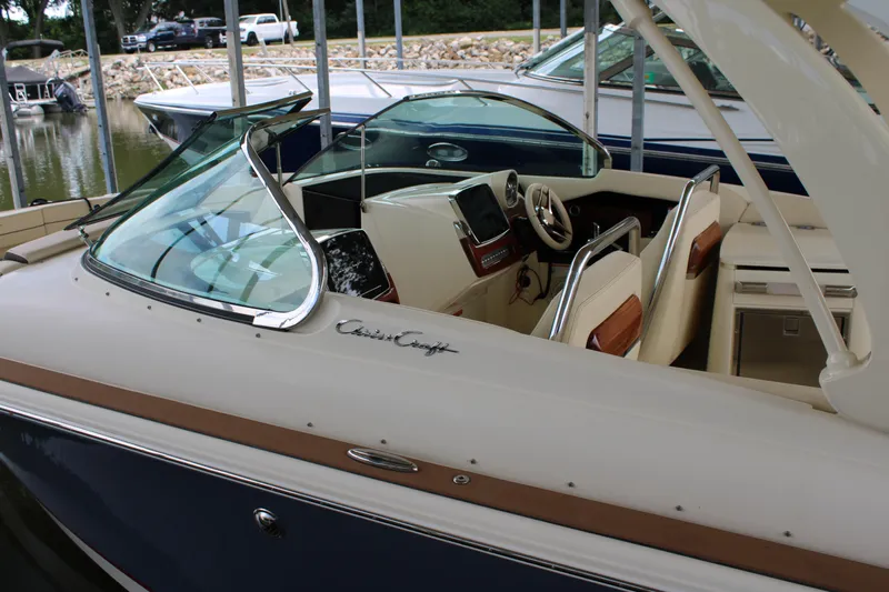 America Yacht Photos Pics 2023 Chris-Craft Launch 31 GT boat interior with elegant seating and dashboard.
