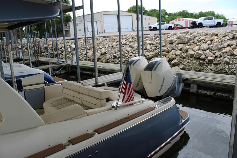 America Yacht Photos Pics 2023 Chris-Craft Launch 31 GT boat docked with twin Mercury engines and American flag.