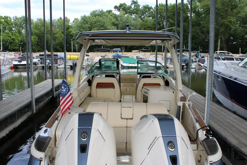 America Yacht Photos Pics 2023 Chris-Craft Launch 31 GT boat docked, rear view with American flag.
