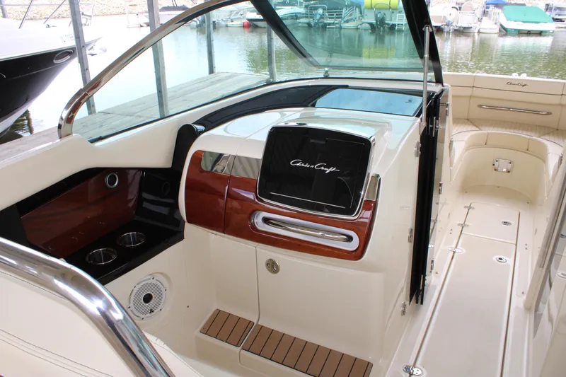 America Yacht Photos Pics 2023 Chris-Craft Launch 31 GT interior with elegant wood accents and modern design.