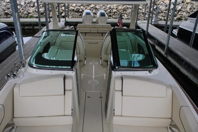America Yacht Photos Pics 2023 Chris-Craft Launch 31 GT boat interior with beige seating and dual windshields.