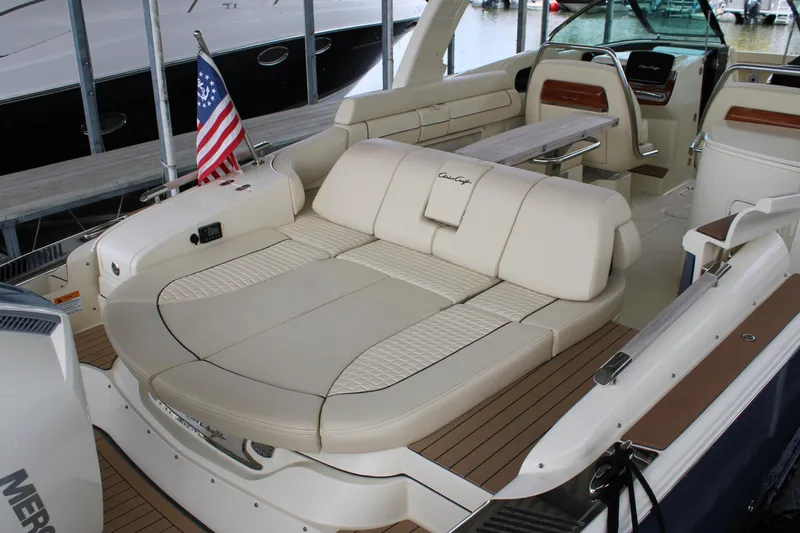 America Yacht Photos Pics 2023 Chris-Craft Launch 31 GT boat interior with luxurious seating and American flag.