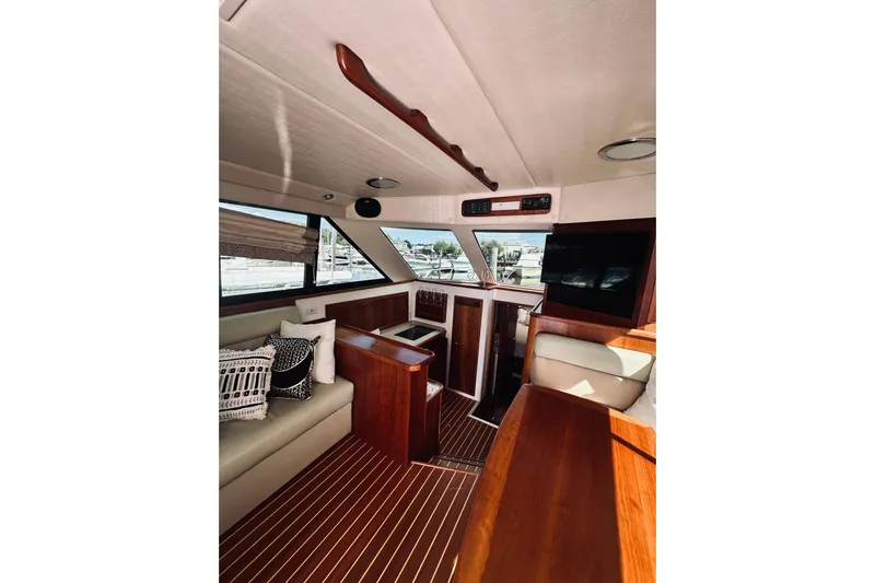 Rah Rah Yacht Photos Pics Interior of 2000 Riviera 40 yacht with elegant wood finish and modern amenities.