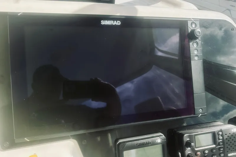 Rah Rah Yacht Photos Pics Simrad navigation system on 2000 Riviera 40 yacht dashboard.