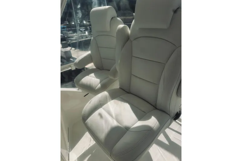 Rah Rah Yacht Photos Pics Luxurious white leather seats on a 2000 Riviera 40 yacht.