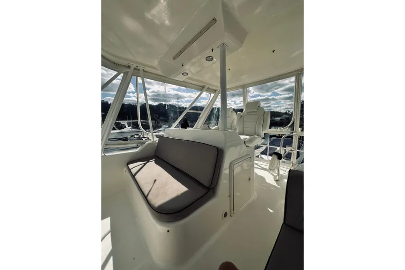 Rah Rah Yacht Photos Pics Interior of 2000 Riviera 40 yacht with cushioned seating and panoramic windows.