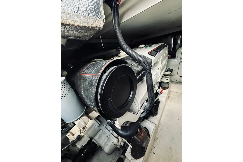 Rah Rah Yacht Photos Pics Engine compartment of a 2000 Riviera 40 boat, showcasing detailed mechanical components.