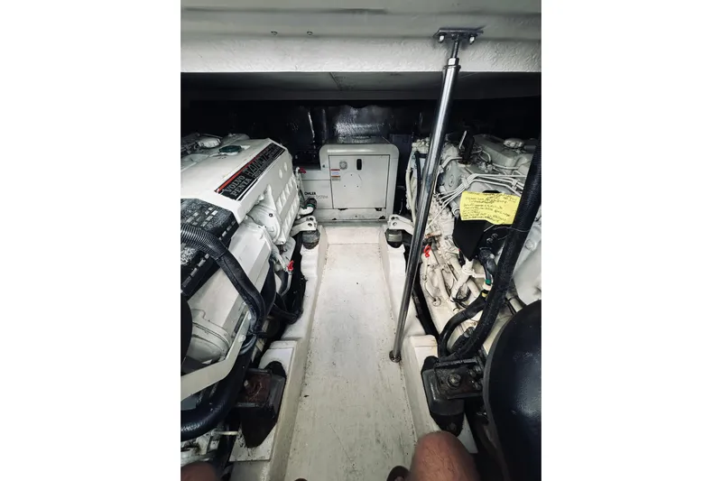 Rah Rah Yacht Photos Pics Engine room of a 2000 Riviera 40 boat, featuring dual engines and mechanical components.