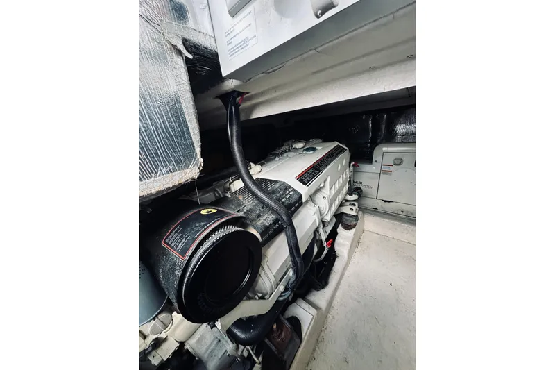 Rah Rah Yacht Photos Pics Engine room of 2000 Riviera 40 yacht, showcasing detailed mechanical components.