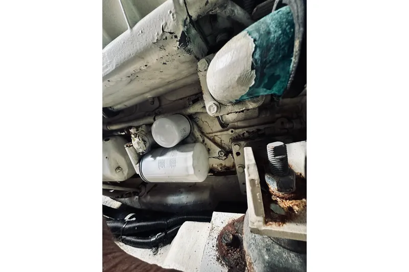 Rah Rah Yacht Photos Pics Engine components of a 2000 Riviera 40 boat, showing filters and mechanical parts.