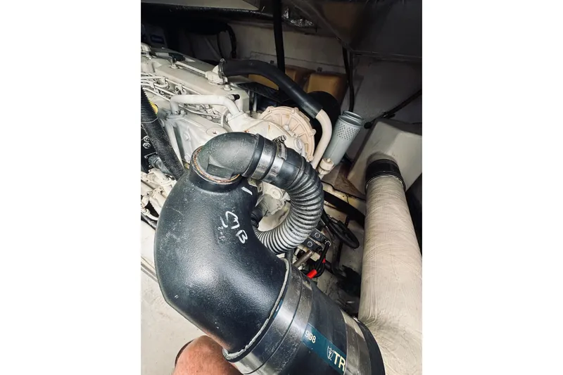 Rah Rah Yacht Photos Pics Engine compartment of a 2000 Riviera 40 boat, featuring hoses and components.