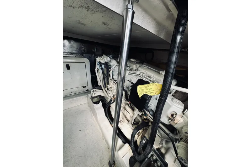 Rah Rah Yacht Photos Pics Engine compartment of a 2000 Riviera 40 boat, showcasing mechanical components.