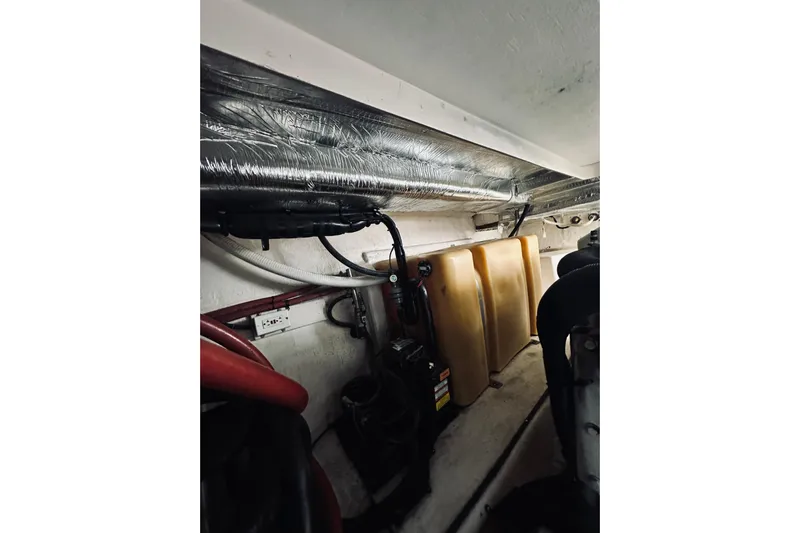 Rah Rah Yacht Photos Pics Engine room of 2000 Riviera 40 yacht with visible components and wiring.