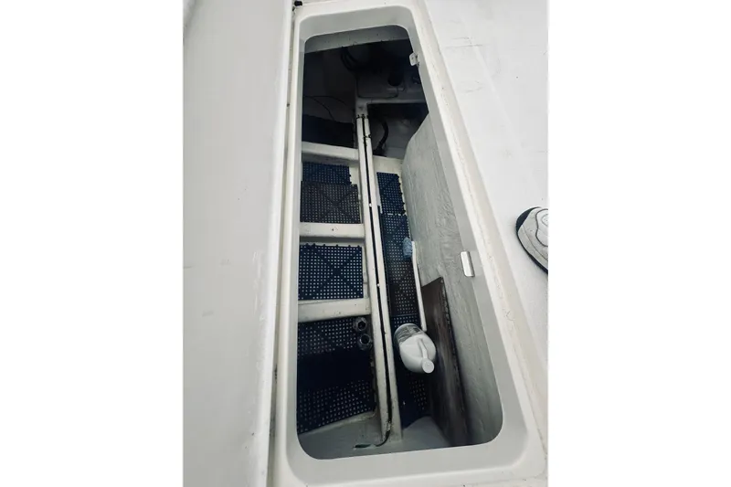 Rah Rah Yacht Photos Pics Open storage compartment on 2000 Riviera 40 boat deck, showing interior details.