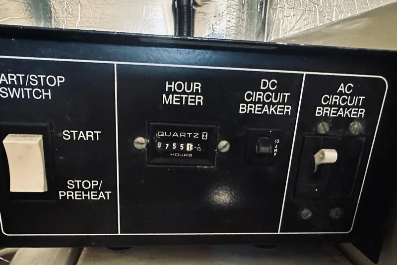 Rah Rah Yacht Photos Pics Control panel of a 2000 Riviera 40 with hour meter and circuit breakers.