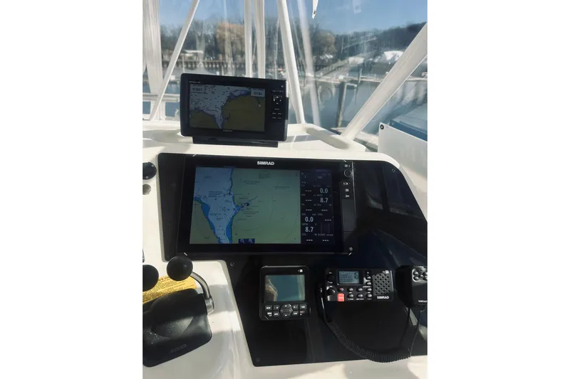 Rah Rah Yacht Photos Pics Control panel of a 2000 Riviera 40 boat with navigation screens and equipment.