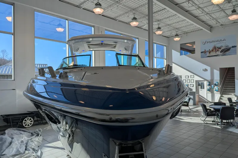 310 Bow Rider Yacht Photos Pics 2025 Formula 310 Bowrider I/O in showroom, modern interior view.