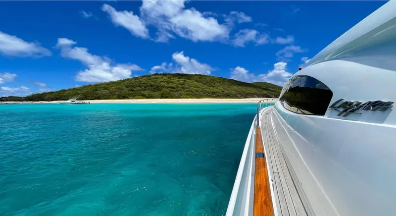 Lovin Life Yacht Photos Pics Lazzara LSX 75 yacht cruising near tropical island, clear blue waters, sunny day, 2008 model.