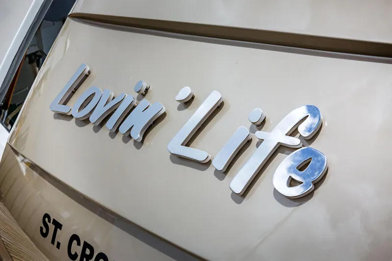 Lovin Life Yacht Photos Pics Close-up of 2008 Lazzara LSX 75 yacht with "Lovin' Life" nameplate.