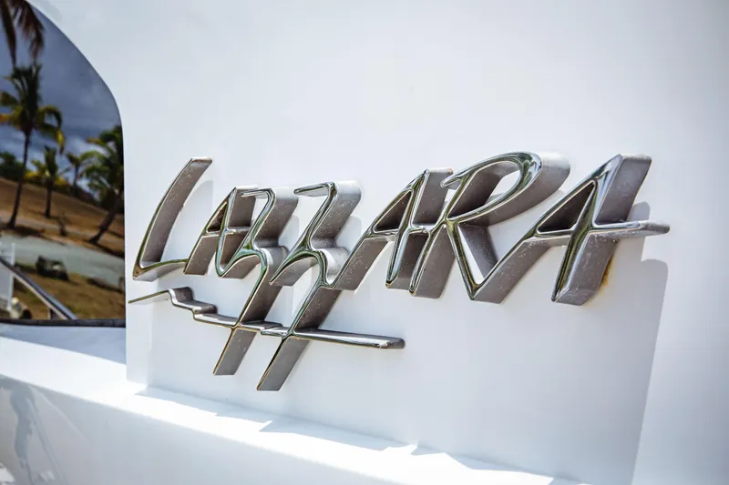 Lovin Life Yacht Photos Pics Close-up of 2008 Lazzara LSX 75 yacht logo with tropical background.