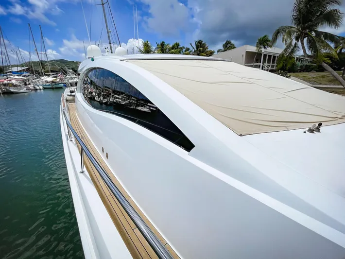 Lovin Life Yacht Photos Pics 2008 Lazzara LSX 75 yacht docked in a tropical marina.