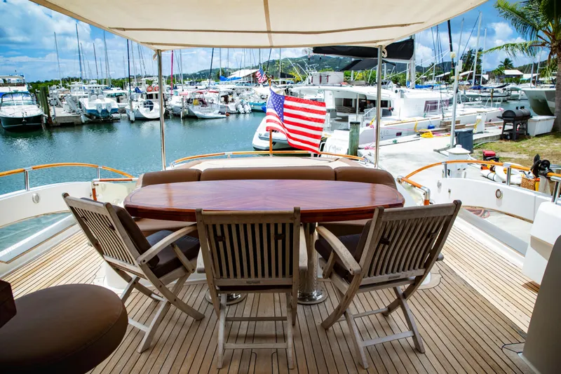 Lovin Life Yacht Photos Pics Luxury yacht Lazzara LSX 75, 2008 model, with elegant deck seating and marina view.