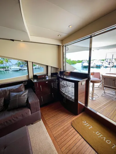 Lovin Life Yacht Photos Pics Interior of 2008 Lazzara LSX 75 yacht with elegant seating and marina view.