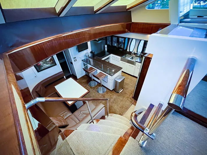 Lovin Life Yacht Photos Pics Luxurious interior of 2008 Lazzara LSX 75 yacht with modern kitchen and seating area.