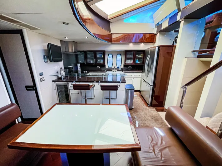 Lovin Life Yacht Photos Pics Luxurious 2008 Lazzara LSX 75 yacht interior with modern kitchen and dining area.