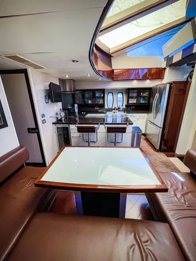 Lovin Life Yacht Photos Pics Luxurious interior of 2008 Lazzara LSX 75 yacht with modern kitchen and seating area.
