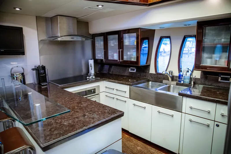Lovin Life Yacht Photos Pics Luxurious kitchen interior of 2008 Lazzara LSX 75 yacht with modern appliances.